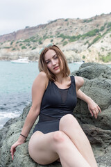 Portrait of attractive young female person at the sea