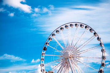 Fototapeta premium activity, amusement, attraction, background, big, blue sky, carnival, carousel, celebration, circle, construction, contemporary, enjoy, entertainment, excitement, fairground, ferris, ferris wheel, fer