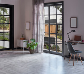 Modern rom with working table and armchair style, parquet floor, frame lamp decor, curtain, garden view house interior.