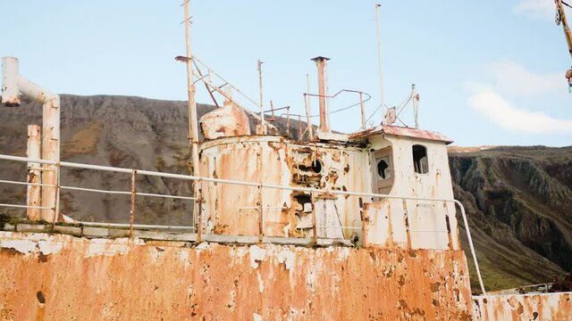 View of the rusty shipwreck, abandoned steel structure and Iceland landscape
