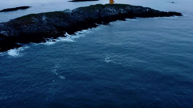 Blue Seascape Revealed Historic Lighthouse Near Flatey Island In Westfjord, Iceland. Aerial Revealing Shot