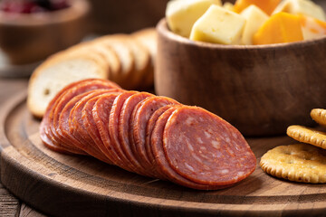 Platter with salami, crackers, toasted rounds and cheese cubes