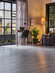 Modern rom with working table and armchair style, parquet floor, frame lamp decor, curtain, garden view house interior.