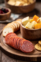 Platter with salami, crackers, toasted rounds and cheese cubes