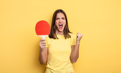 pretty woman shouting aggressively with an angry expression. ping pong concept