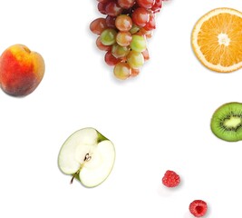 Creative happy and healthy new year card made of grapes, apple and apricot on the white background.