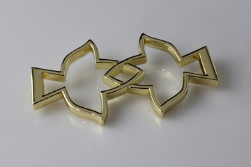 Metallic Bag Decoration. Decorative brooch in the shape of two birds flying to meet each other. A...