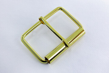 Metal gold buckles for bag with a rounded tongue. Accessories for the manufacture of collars and straps for clothes and bags. chrome-plated buckles on white background
