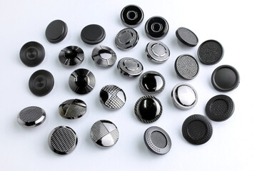 Metal button for clothes, nickel color. Sewing accessories for outerwear production. Components of...