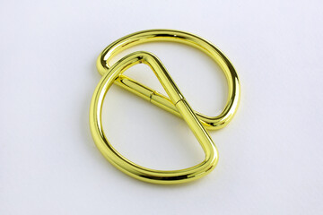 Tia D ring buckle strap semi- circular close-up on a white background. D- shaped Loop small half ring. D-Ring for purse, bag making, hanging decorative accessories.