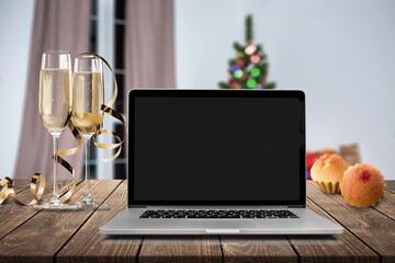 Laptop on the christmas table. Video call with the family in times of coronavirus.