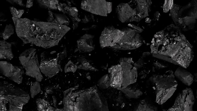 Super Slow Motion Shot of Coal Explosion Isolated On Black Background at 1000 fps.