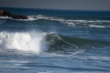 waves crashing on rocks