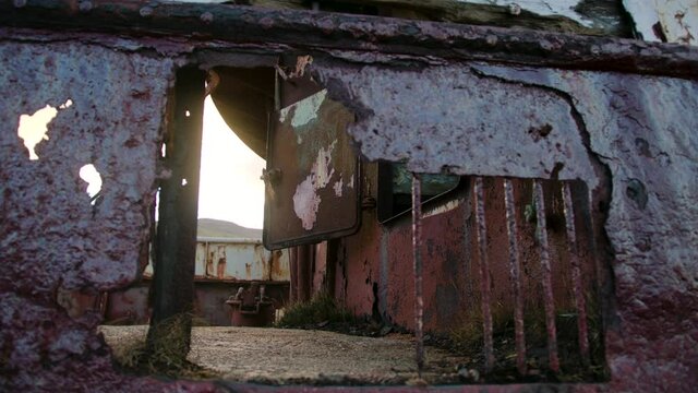 Cracked shipwreck, corroded and decomposed metal and a hole in the hull of a ship