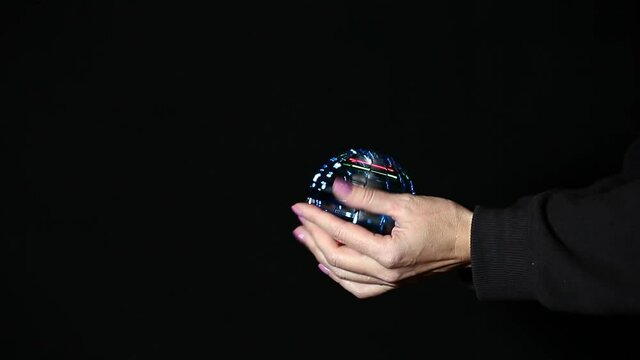 footage of spinner hand dark background