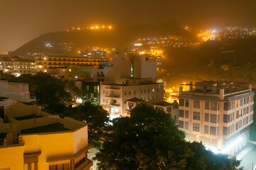 Calima night in Santa Cruz de Tenerife. Sand in the city air. Canary islands, Spain