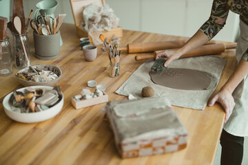 Close-up of craftswoman working on her pottery in workshop
