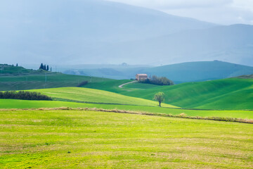 Amazing spring morning among picturesque green rolling hills in the heart of Tuscany