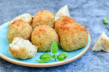 Italian arancini. Home made  tradiotonal rice balls with mozzarella cheese,parsley ,lemon and parmesan cheese.