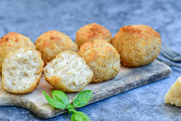 Italian arancini. Home made  tradiotonal rice balls with mozzarella cheese,parsley ,lemon and parmesan cheese.