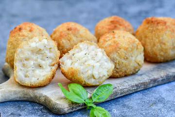Italian arancini. Home made  tradiotonal rice balls with mozzarella cheese,parsley ,lemon and parmesan cheese.
