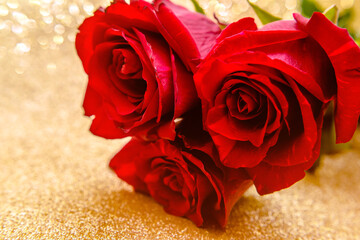 Red rose on a shiny gold background
