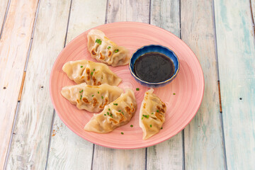 Gyoza, also known as yaki gyoza, are Japanese dumplings similar to the famous Chinese dumplings