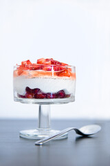 Strawberries in whipped cream in a crystal glass goblet. High quality photo