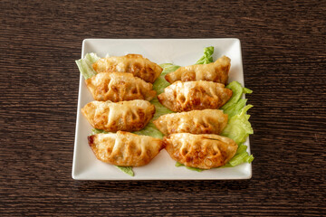 The Japanese call them gyozas, but this type of dumplings are present in cookbooks throughout Asia.