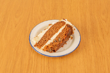Fototapeta na wymiar Carrot cake with carrot puree mixed in batter. The carrot becomes soft and the tart tends to have a dense and smooth texture. Carrots enhance the flavor, texture, and appearance of the cake.