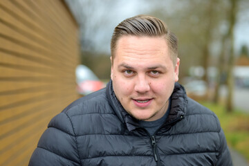 Intense young man staring into the camera with parted lips