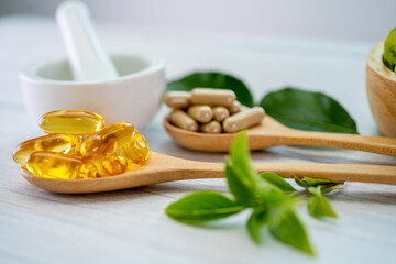 Alternative medicine herbal organic capsule with vitamin E omega 3 fish oil, mineral, drug with herbs leaf natural supplements for healthy good life.