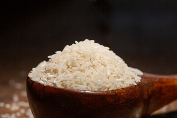 The rice is on the wooden table