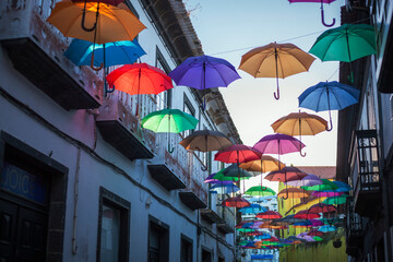 Fototapeta na wymiar Colorful umbrellas, ready to be retouched to their best color. No color-grading, very good raw material for any results you are looking forward to achieving.