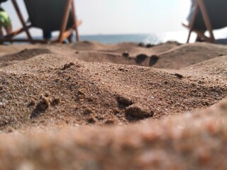 Fototapeta na wymiar Beach Chairs Water Horizon Sun Warm Sand