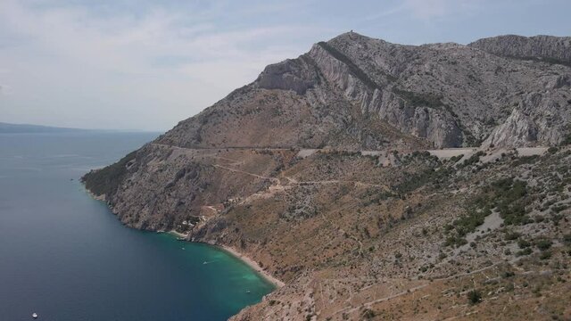 Incredibly beautiful beach Vruja on a background of mountains in the Makarska Riviera in Croatia.