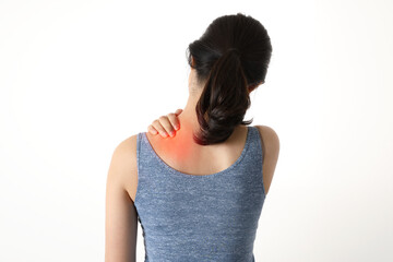 Back view of woman holding sore back neck and shoulder and waist(marking red)