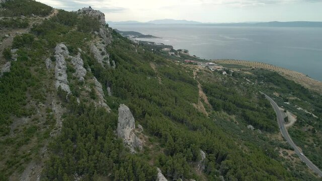 Babin zub. Big stone on the rocks of the Croatian coast cliffs. Croatia Makarska Riviera aerial view.