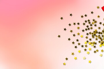 Golden stars confetti on a pink pastel background. Holidays banner with place for text.