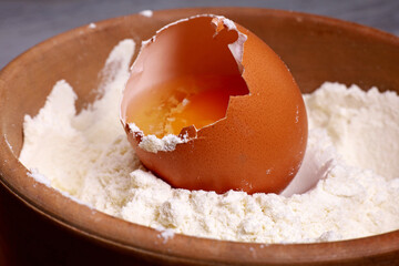 bowl of flour and broken egg