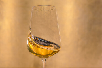 Close up of a glass of golden wine