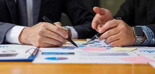 Team of Businessman working at office with documents on his desk, doing planning analyzing the...
