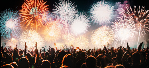 crowd and explosive fireworks New Year celebrations