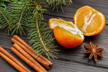 Tangerine halves and cinnamon sticks.