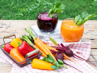 Fresh squeezed smoothie bell pepper, carrot, beetroot juice vegetable in a glass. Healthy eating, detox, dieting.