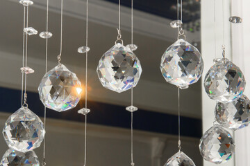 Glass faceted interior hanging balls. Chandelier with sparkling crystal ball.