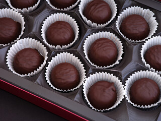 Box full of chocolate candies.
