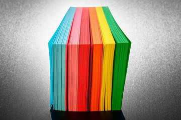 Close-up of a colorful post it cube. Group of notes of six different colors positioned vertically...