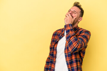 Fototapeta premium Young caucasian man isolated on yellow background laughing happy, carefree, natural emotion.
