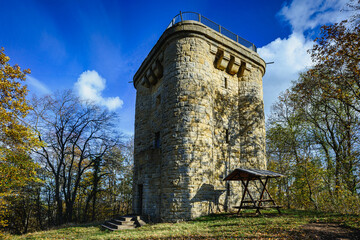 Bright autumnal day with the Bismarck Tower near Ballenstedt in Saxony-Anhalt surrounded by greenery